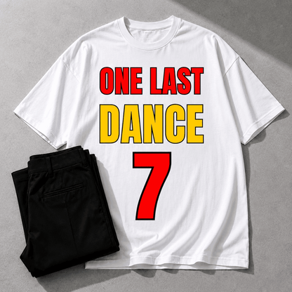 White t-shirt with 'ONE LAST DANCE 7' text on a gray background